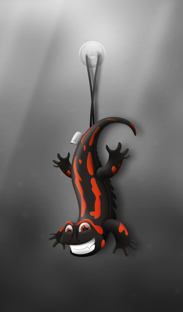 Ящерица игрушка, серый фон