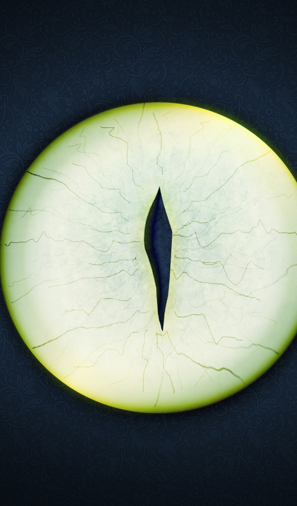 Круглый зеленый глаз на черном фоне