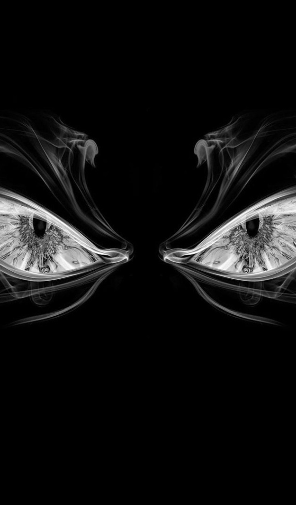 Глаза из дыма на черном фоне
