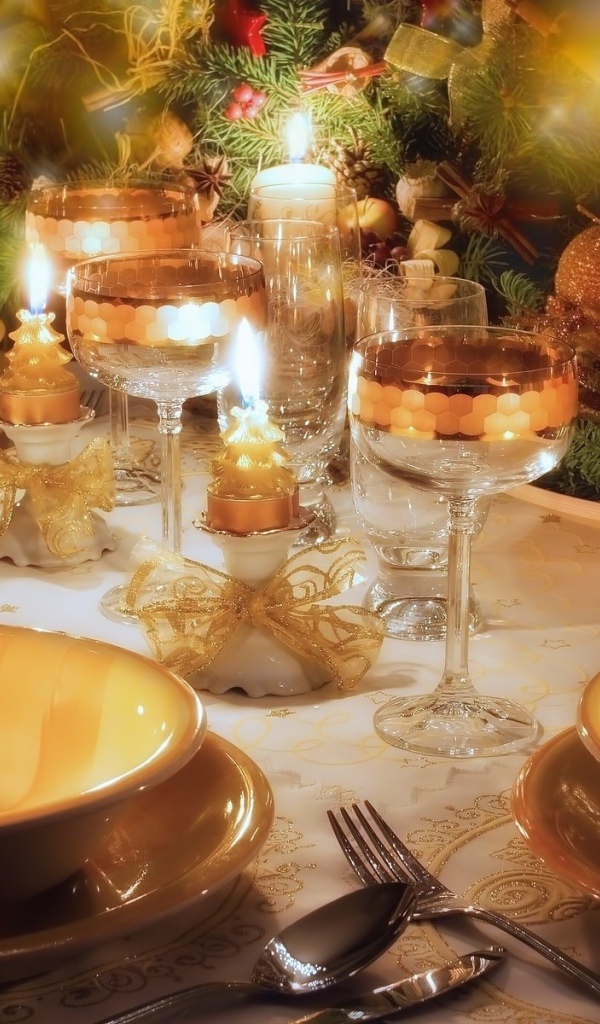 Candles in the dishes on the holiday table