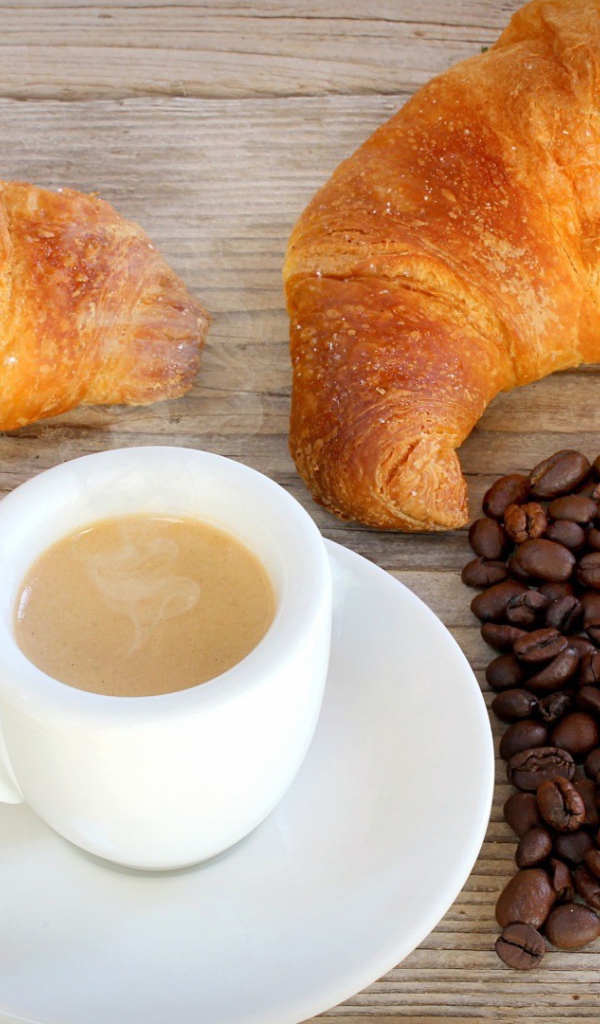 Two French croissant and a cup of coffee