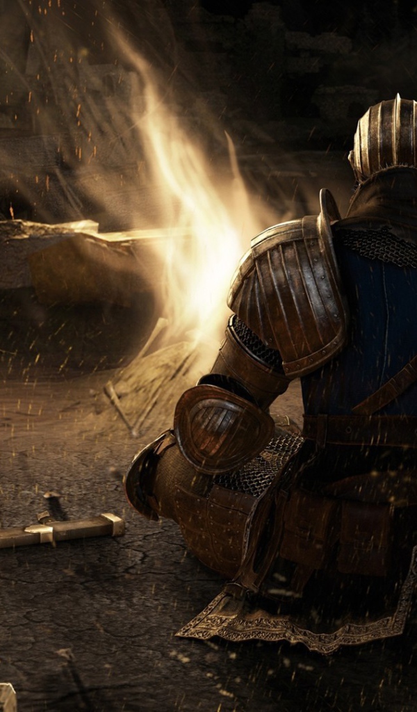 Солдат в доспехах у костра в игре Dark Souls