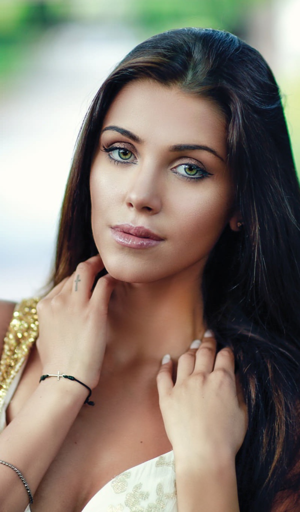 Green-eyed brunette with long hair, portrait