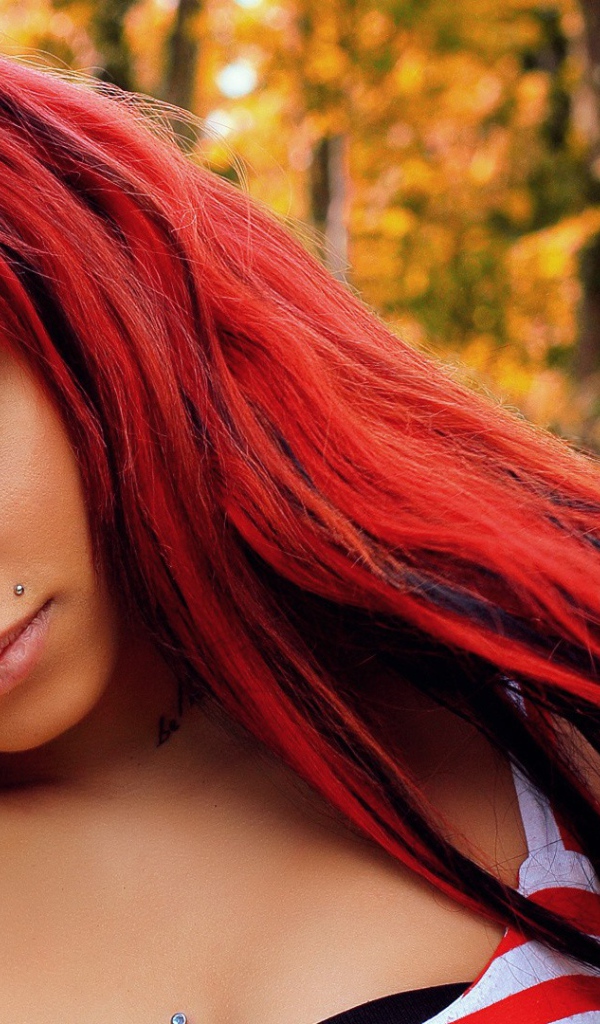 The girl with red hair and a nose ring