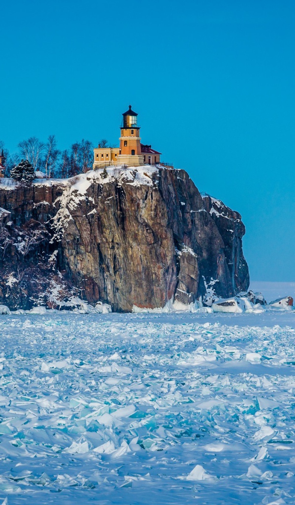 Lighthouse over the frozen sea