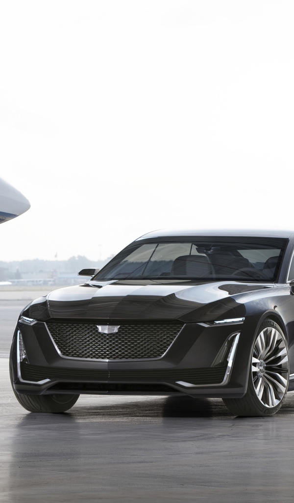 Black stylish Cadillac Escala on the background of aircraft
