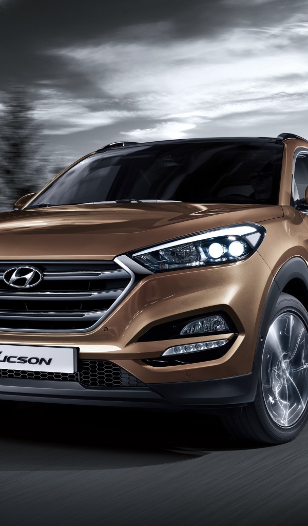 Автомобиль Hyundai Tucson коричневого цвета 