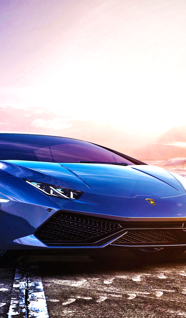 Синий спортивный автомобиль Lamborghini Huracan LP 610-4 на фоне океана 