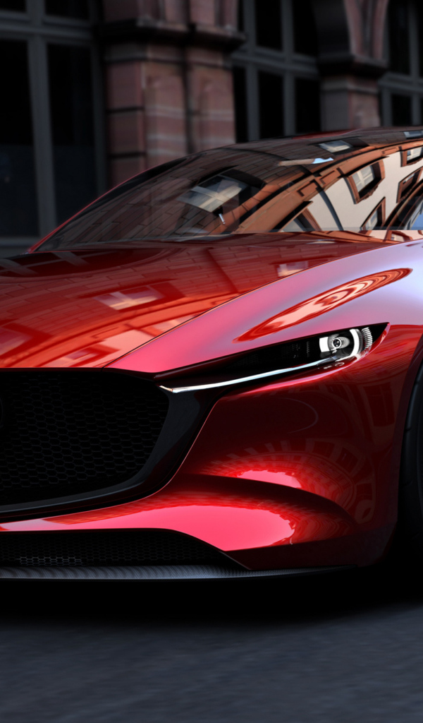 Красный автомобиль Mazda Kai на улицах города