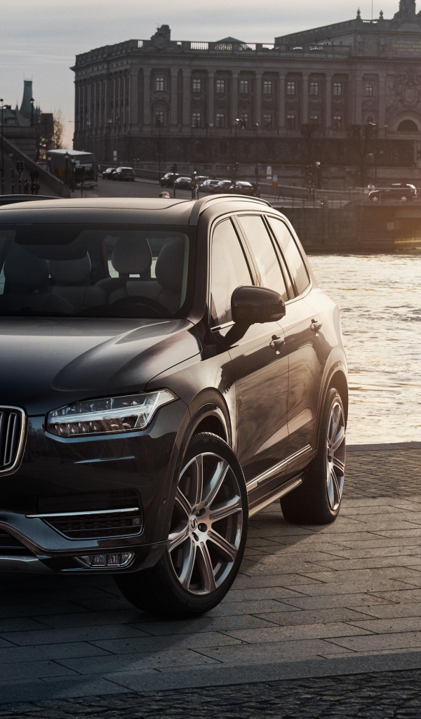 Black crossover Volvo XC90 at the river