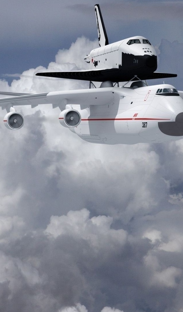 Самолет Ан- 225 Мрия  и ракета носитель «Буран» в на фоне белых облаков 