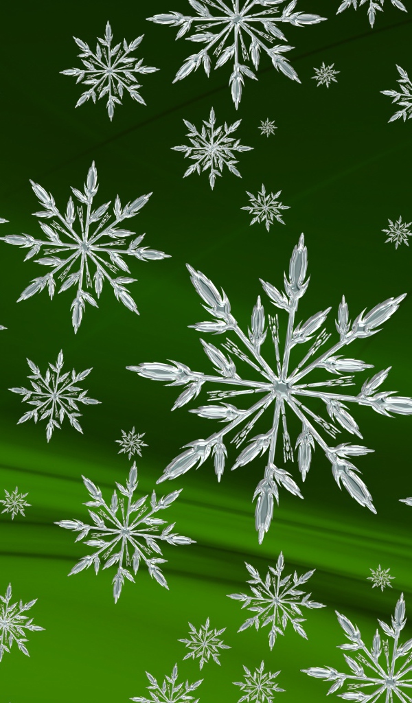 Кристальные белые снежинки на зеленом фоне