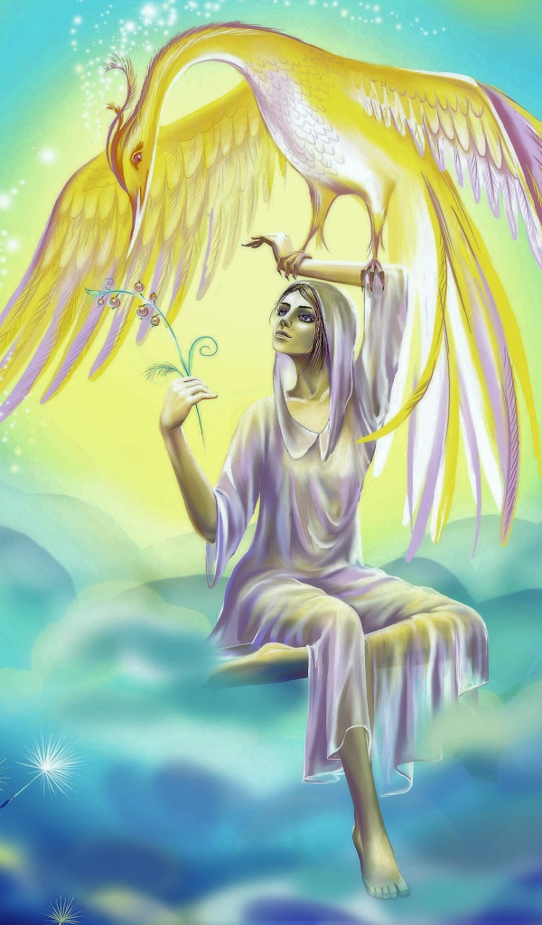 Красивая фантастическая девушка держит на руке птицу феникс