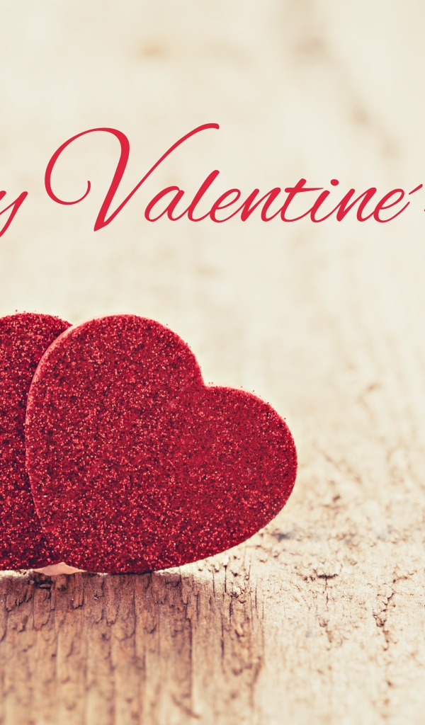 Два красных сердца на фоне надписи С Днем Святого Валентина