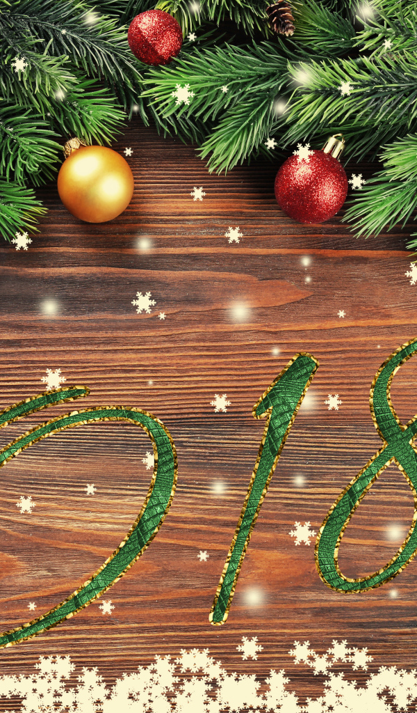 Цифры 2018 на фоне новогоднего декора