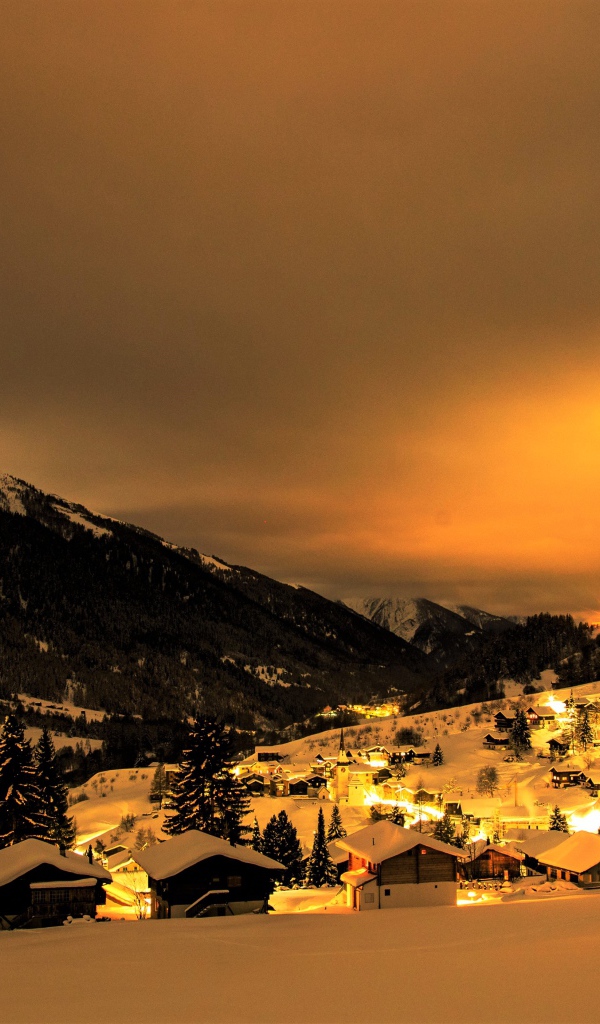 Winter night in a mountainous city, Switzerland