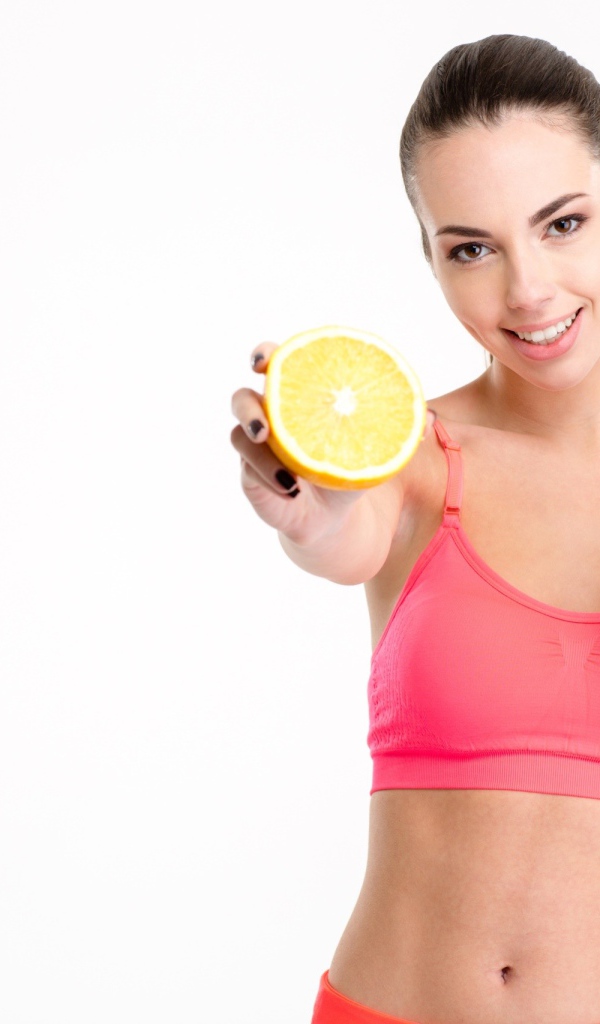 Спортивная девушка с апельсиновым соком 