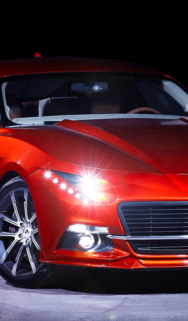 Красный автомобиль Warszawa M20 GT 2018 года с включенными фарами