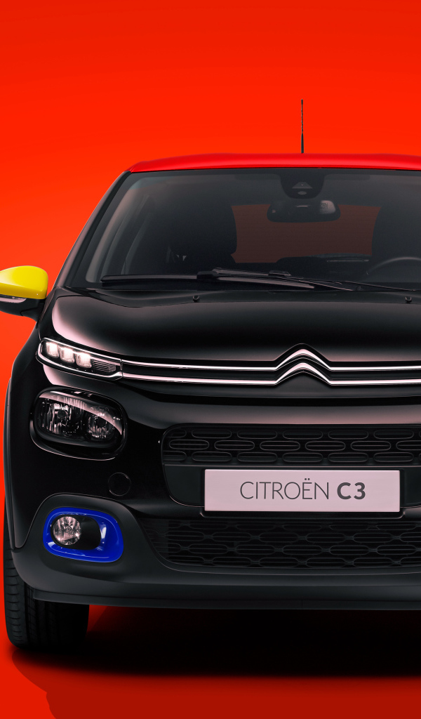 Черный автомобиль Citroen C3 JCC на красном фоне