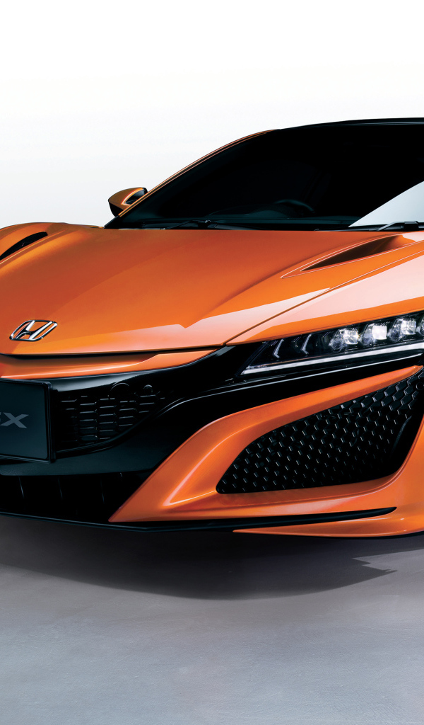 Оранжевый быстрый автомобиль Honda NSX 2018 года