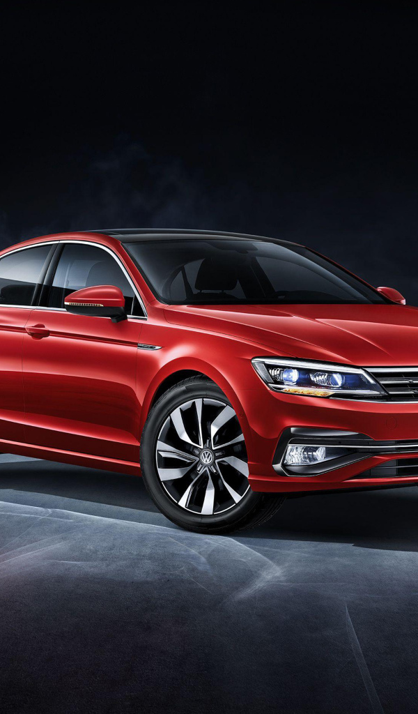 Красный автомобиль Volkswagen Lamando, 2018 на сером фоне