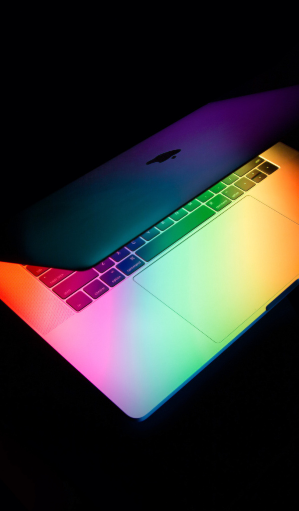 Открытый MacBook Apple  на черном фоне