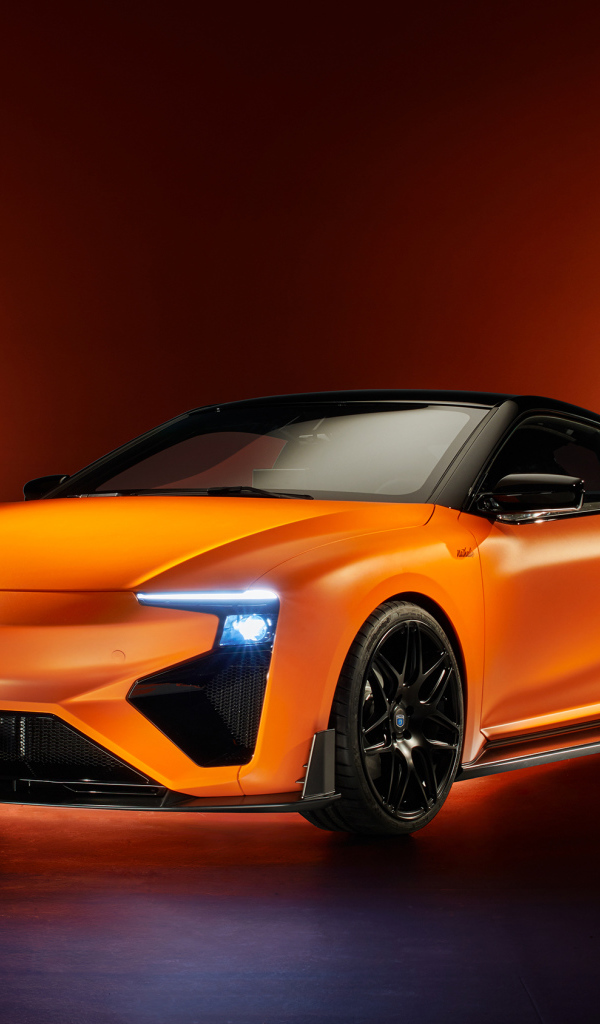 Оранжевый автомобиль Gumpert RG Nathalie 2019 года с включенными фарами
