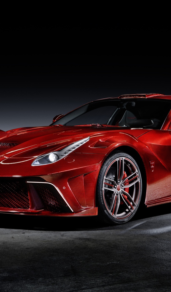 Красный автомобиль Mansory La Revoluzione на сером фоне