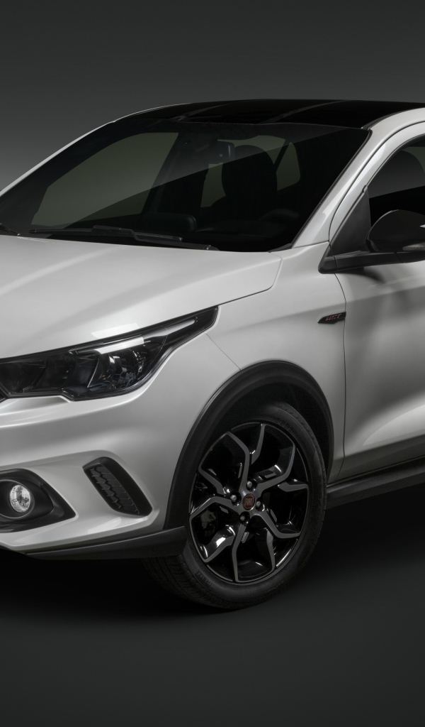 Белый автомобиль Fiat  Argo HGT, 2019 года на сером фоне
