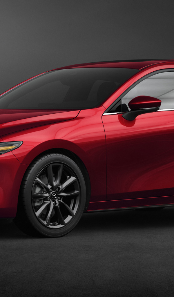 Красный автомобиль Mazda 3, 2020 года на сером фоне