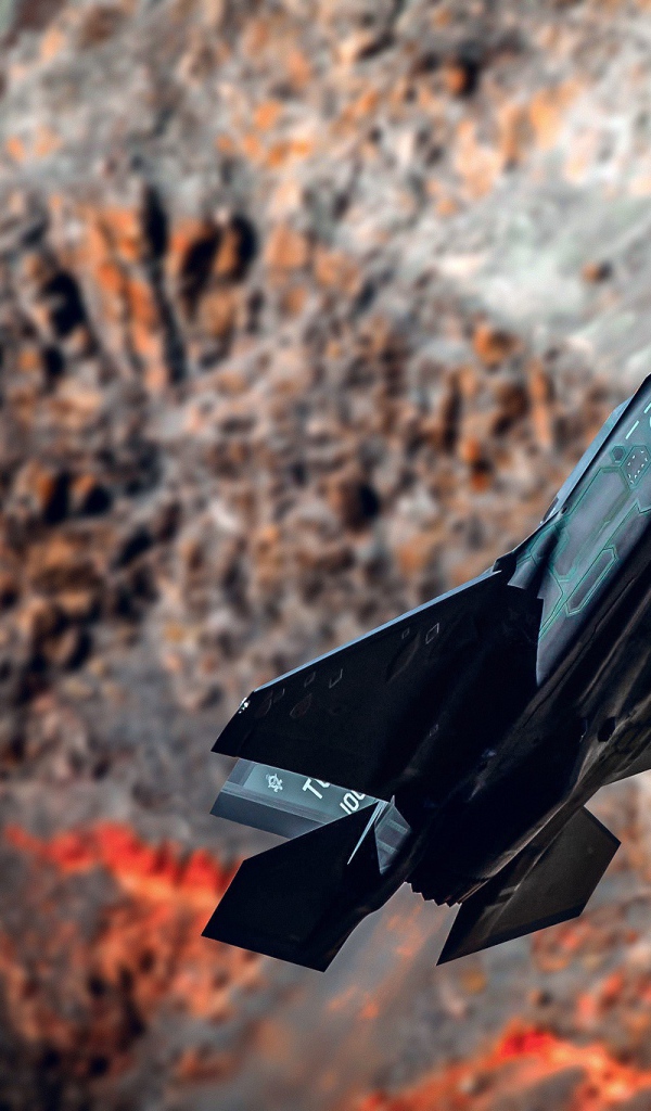 Черный истребитель F-35A Lightning II на фоне гор