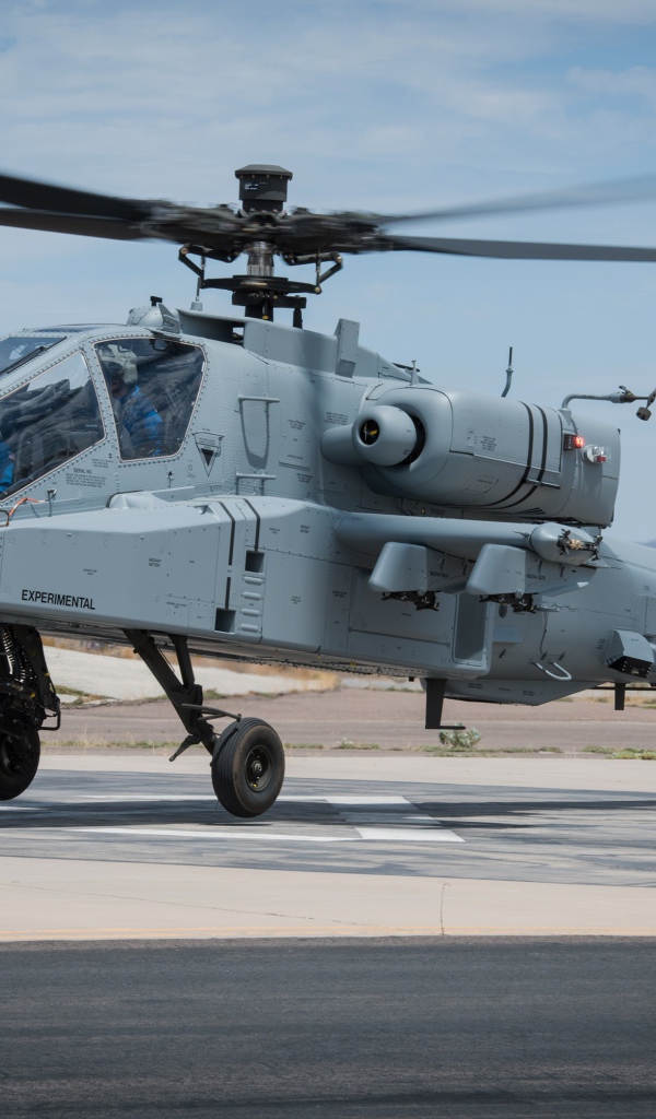 Military helicopter Boeing AH-64 Apache is preparing for takeoff