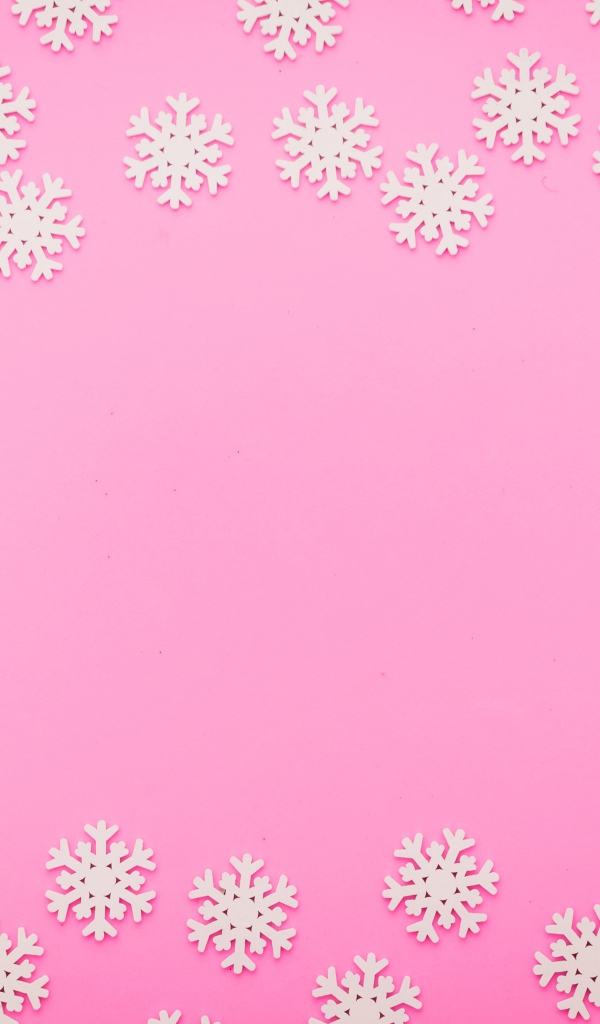 Много белых снежинок на розовом фоне