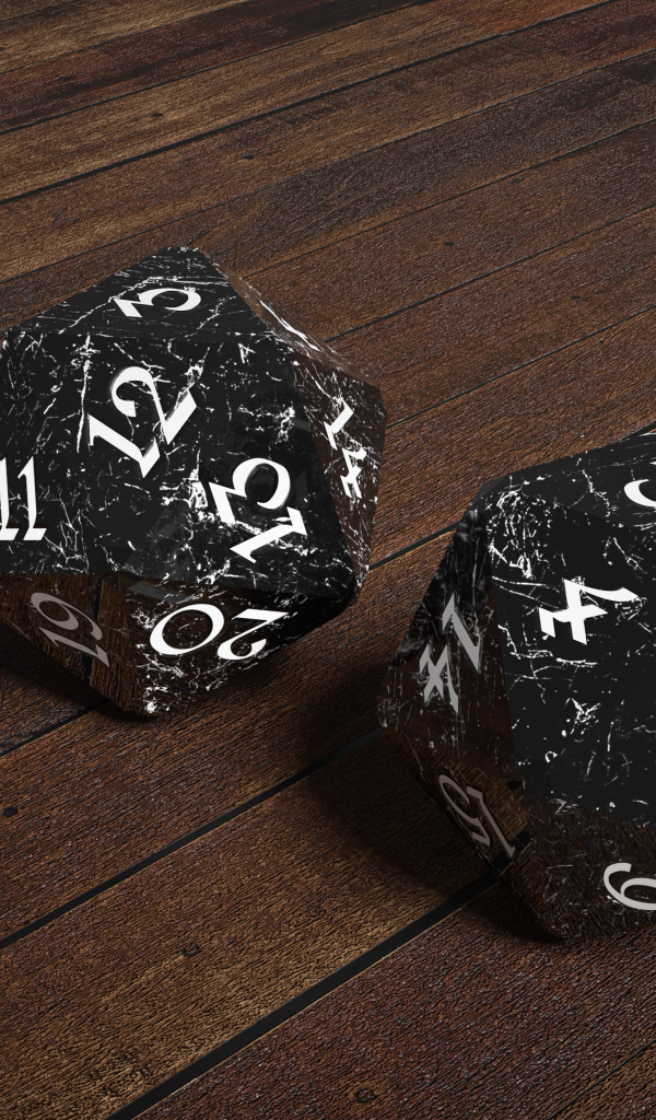 Два черных камня с цифрами на деревянном столе