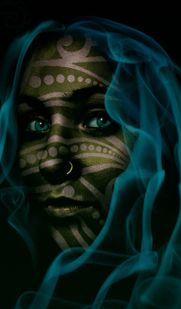 Fantastic green-eyed girl with blue smoke hair