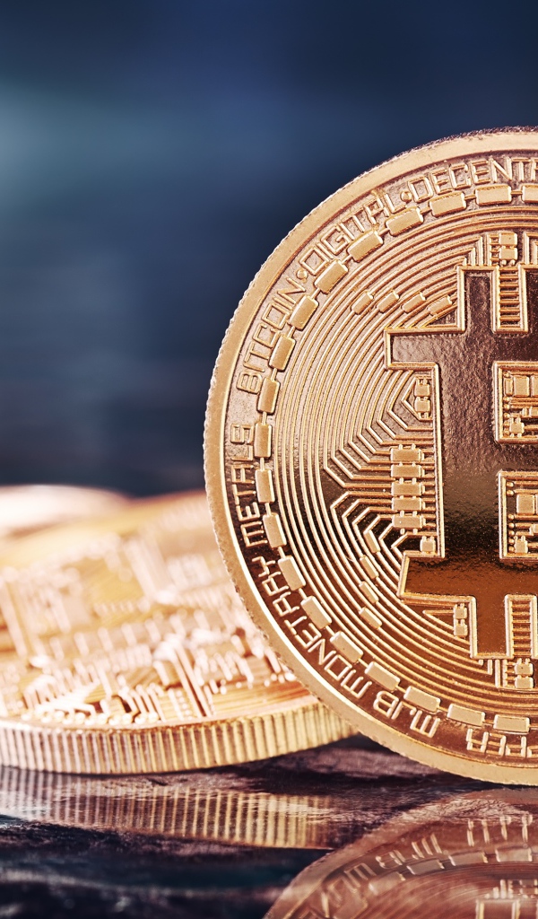 Big golden bitcoin coin close up