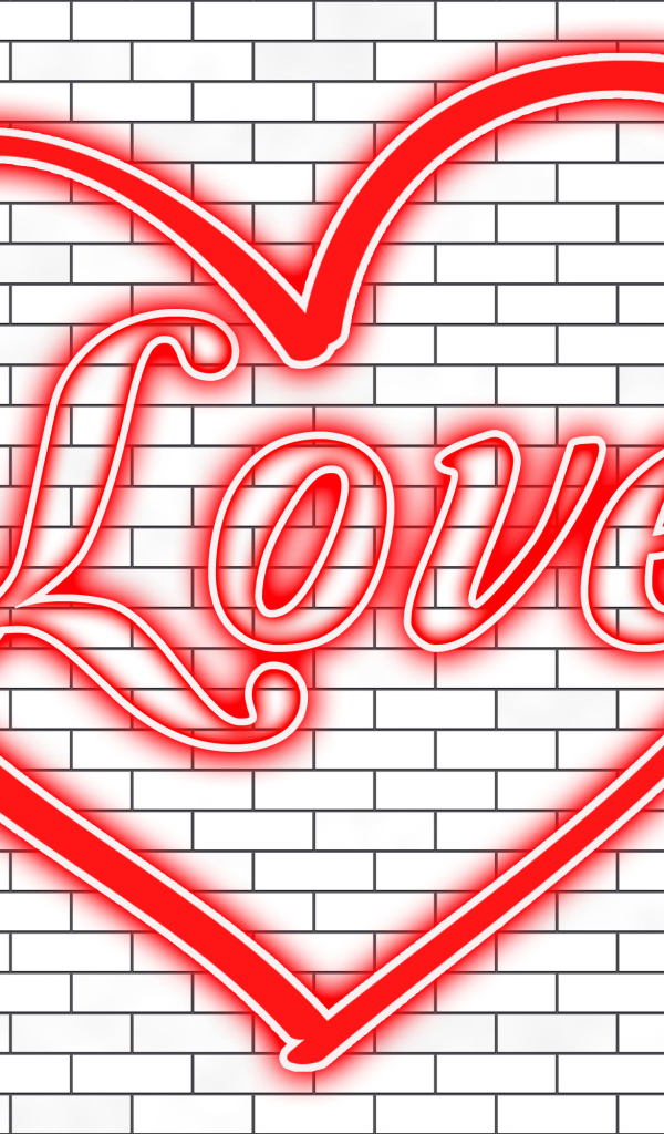 Красное сердце с надписью Любовь на кирпичной стене