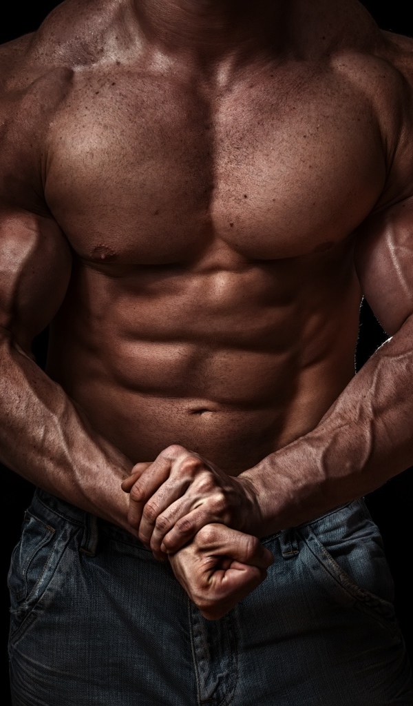 Body of a pumped man on a black background