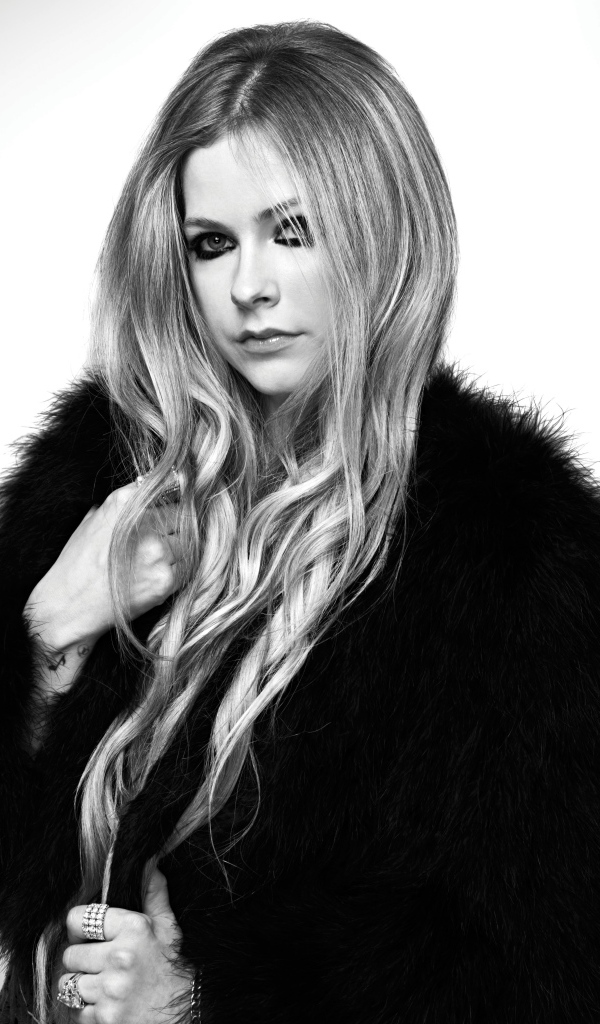 Singer Avril Lavigne in a black and white fur coat