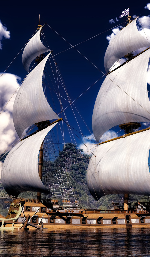 Красивое парусное судно на фоне белых облаков