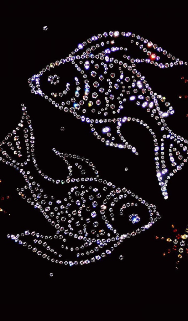 Shiny fish zodiac sign on a black background.