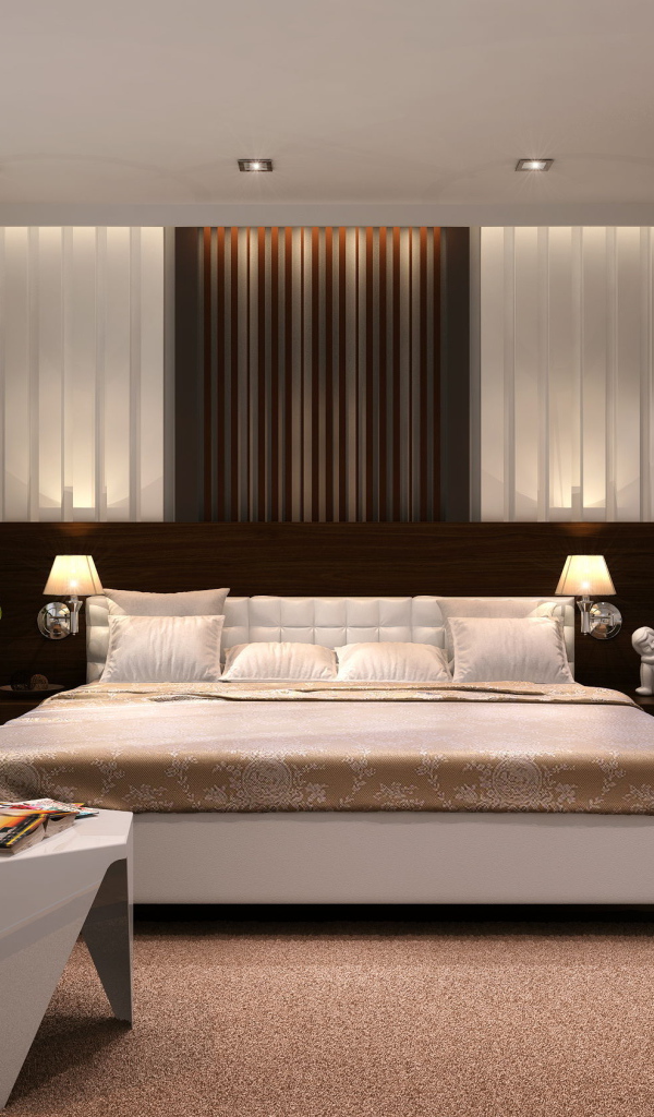 Большая кровать в просторной спальне со шкафом 