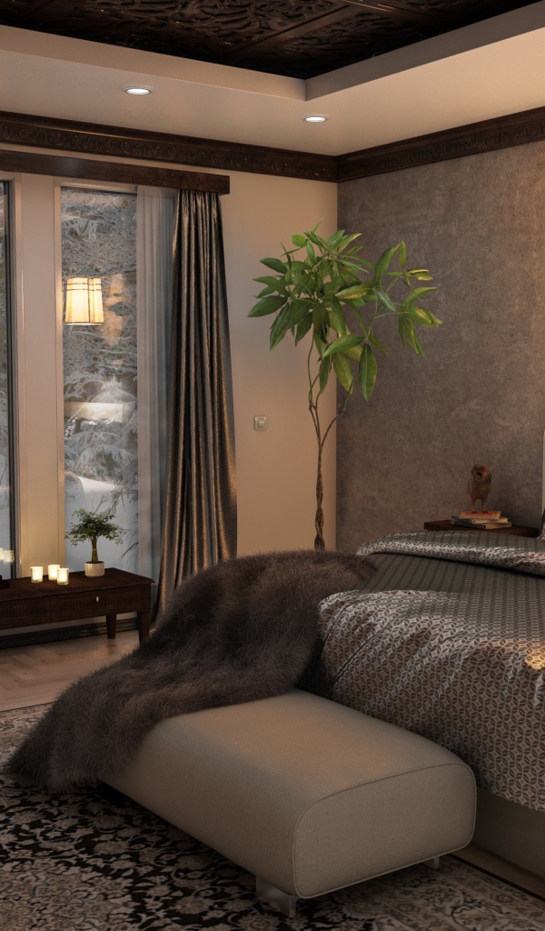 Большая кровать с красивым покрывалом в спальне с большим окном 