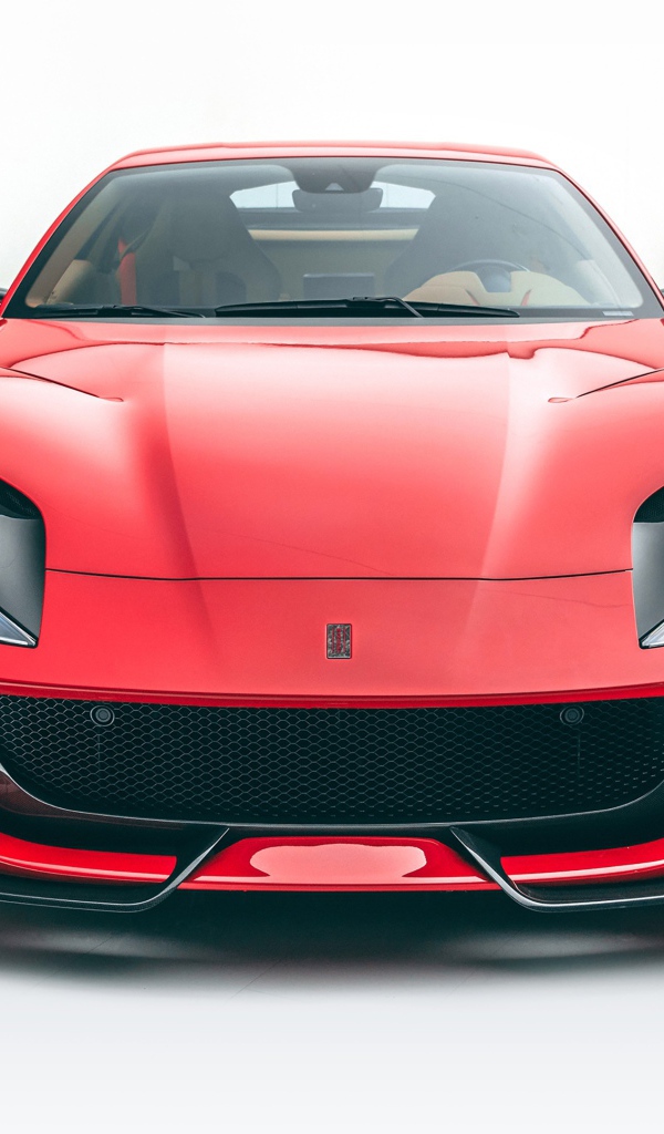 Красный автомобиль Mansory Ferrari 812,  2020 года на белом фоне