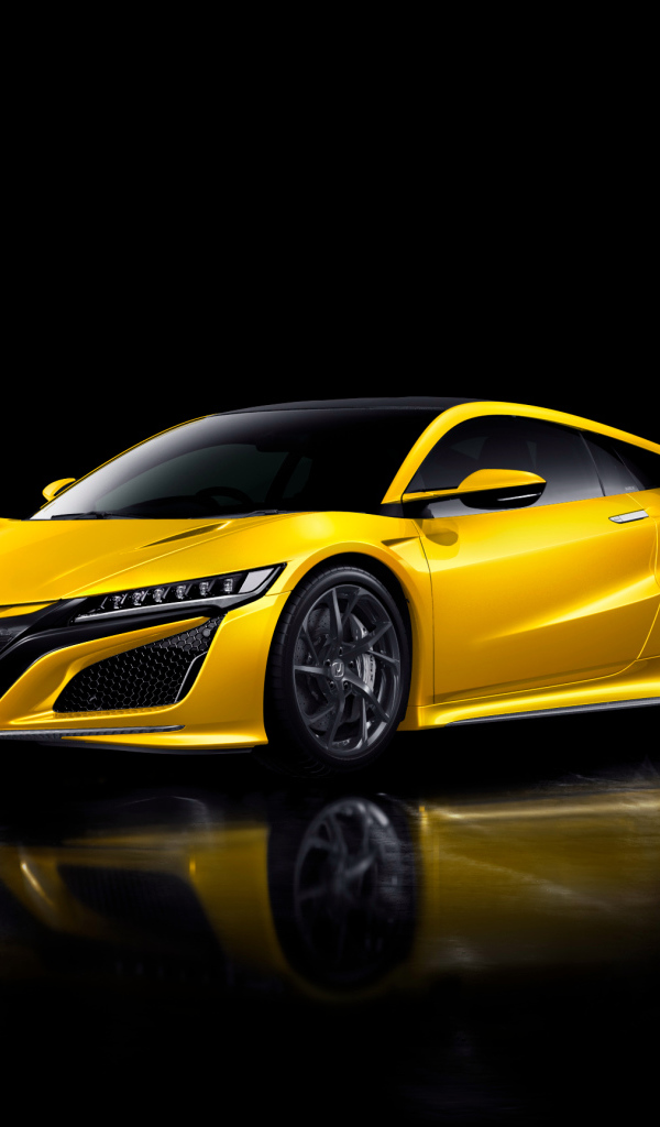 Желтый автомобиль Honda NSX на черном фоне