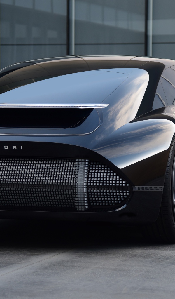 Черный автомобиль Hyundai Prophecy 2020 года вид сзади на сером фоне