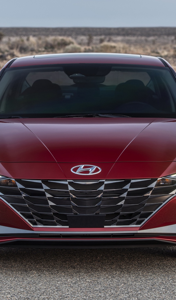 Красный автомобиль  Hyundai Elantra, 2021 года на пустыре