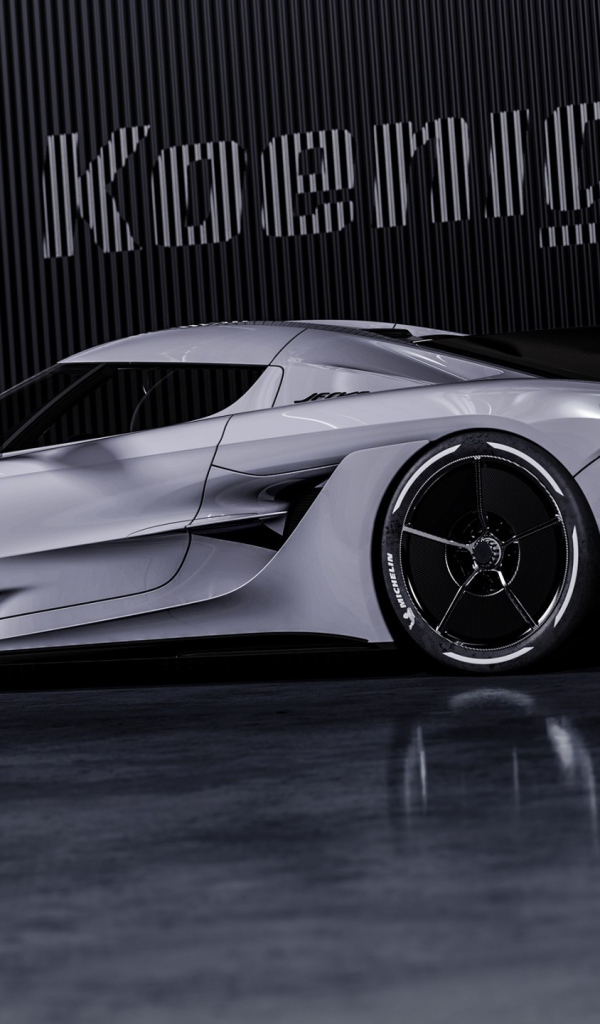 Автомобиль Koenigsegg Jesko Absolut 2020 года на фоне логотипа