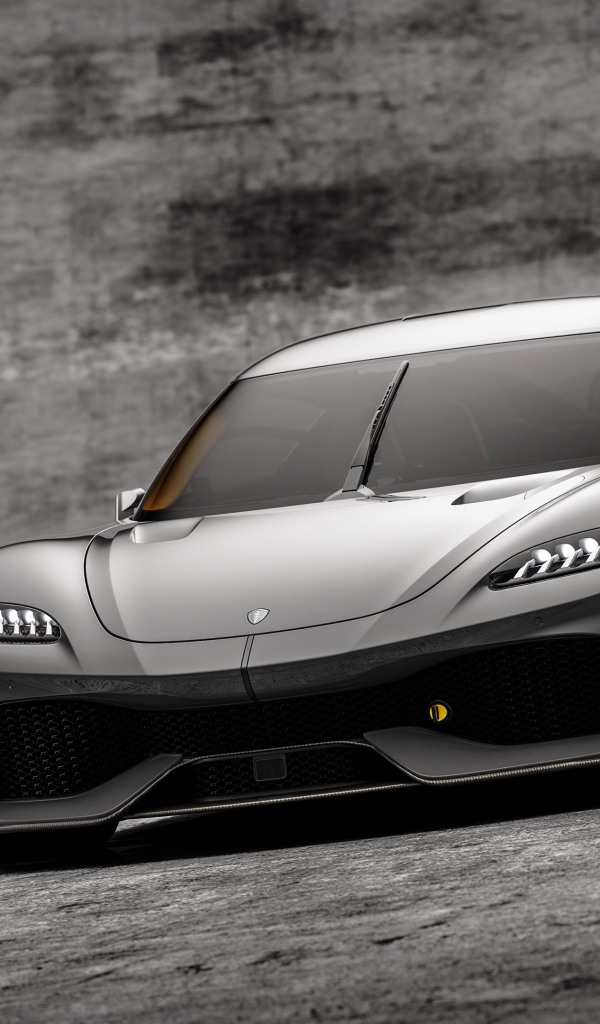 Автомобиль Koenigsegg Gemera 2020 года на сером фоне