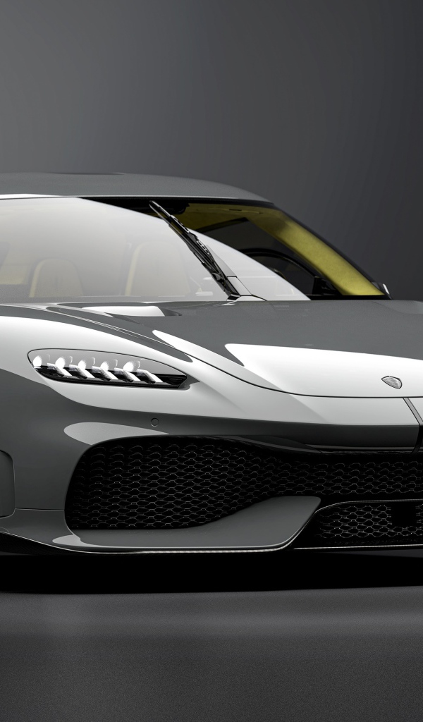 Быстрый автомобиль Koenigsegg Gemera 2020 года на сером фоне